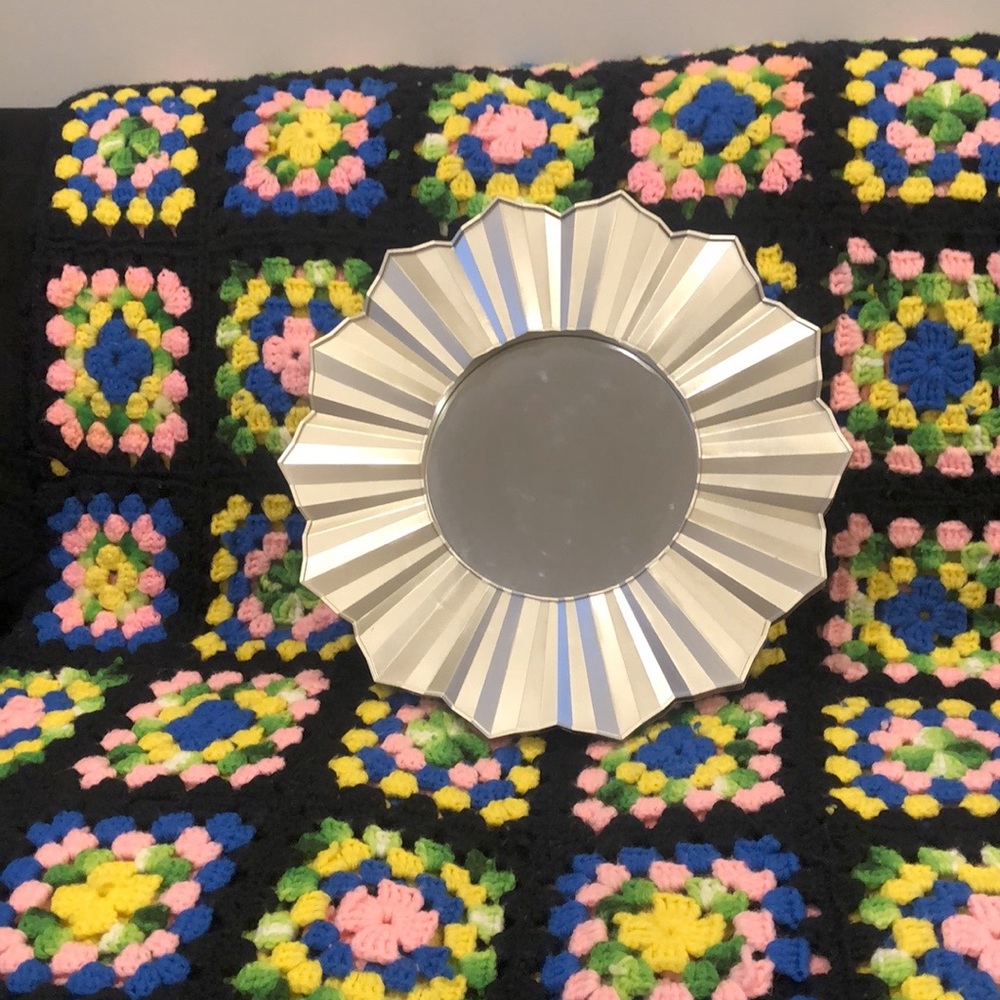 Gold sun shaped mirror